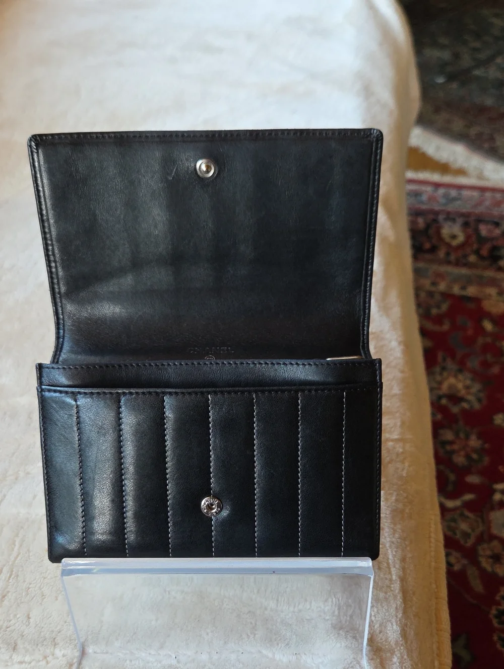 CHANEL Mademoiselle Black Vertical Quilted Leather Wallet with Silver CC Emblem